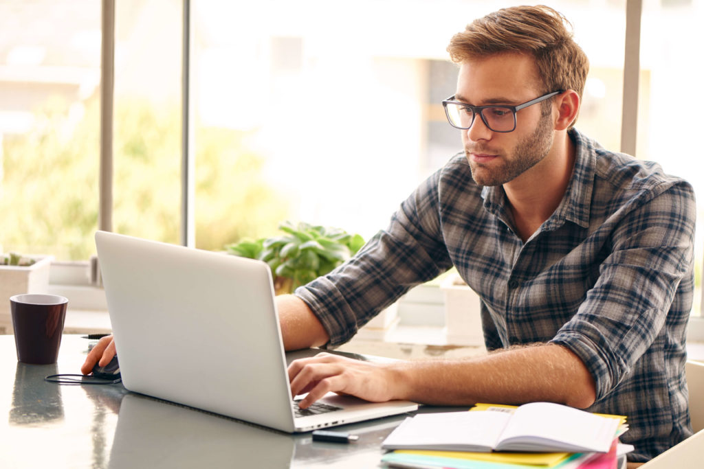 man online learning on laptop