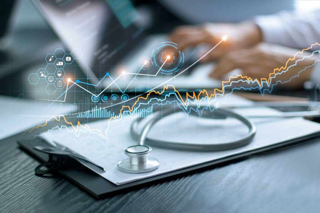 stethoscope and business graphs
