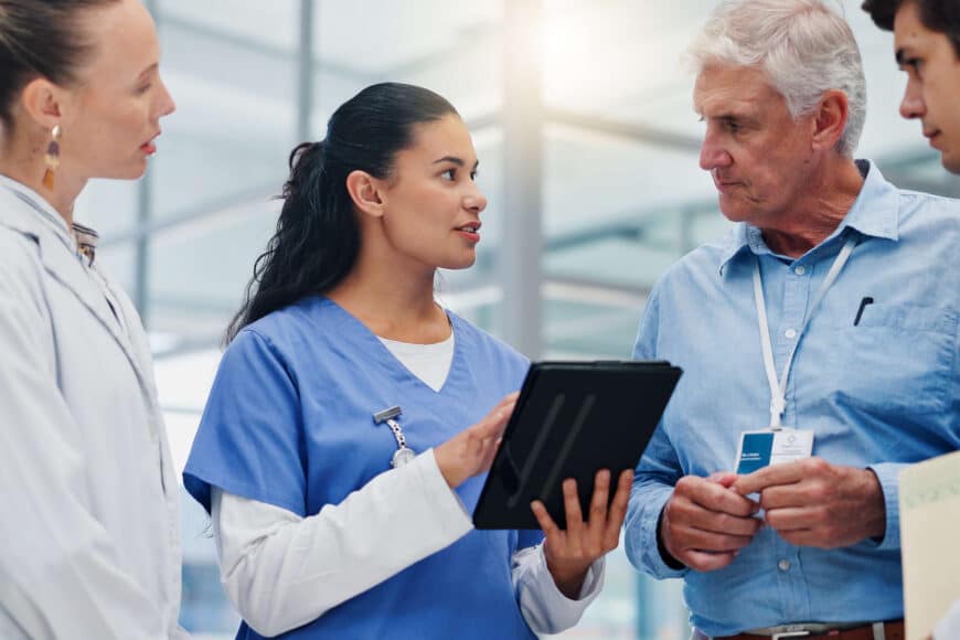nurse leader discussing plans with team