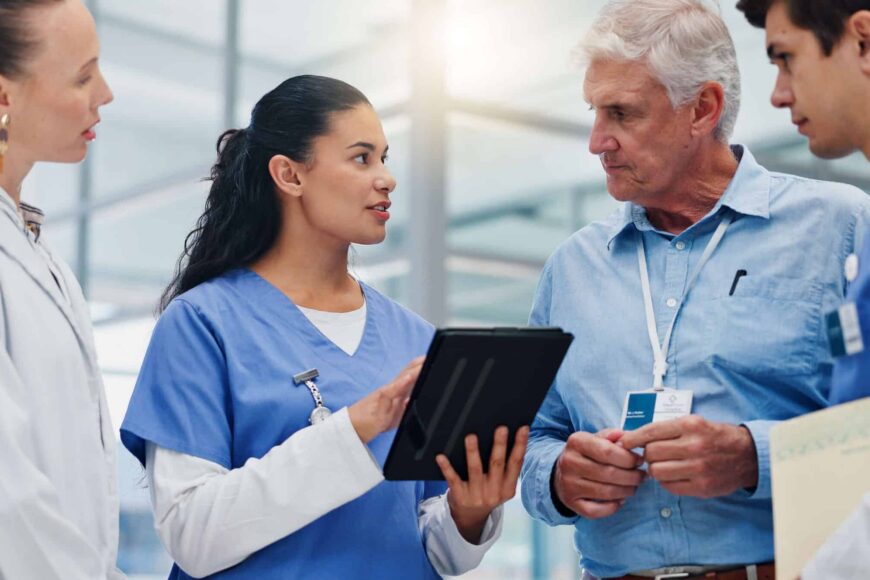 nurse leader discussing plans with team