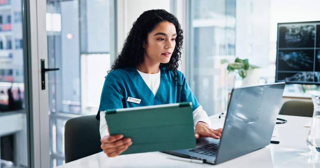 RN taking MSN classes on laptop