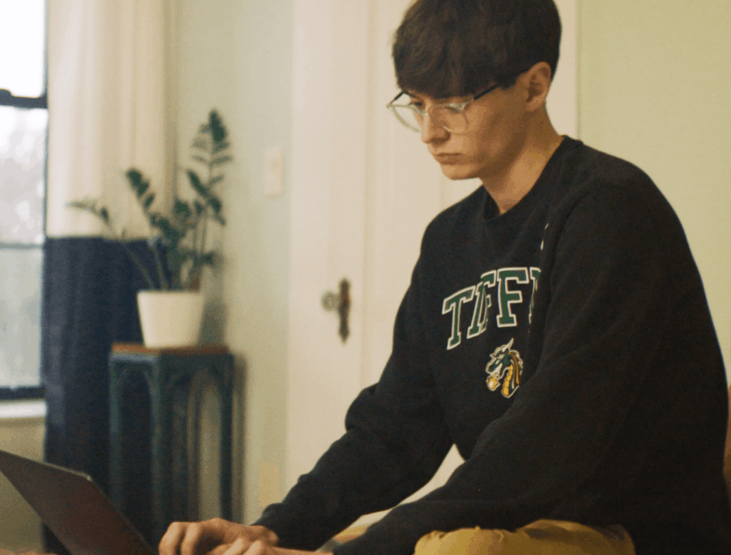 troy thrush working on laptop